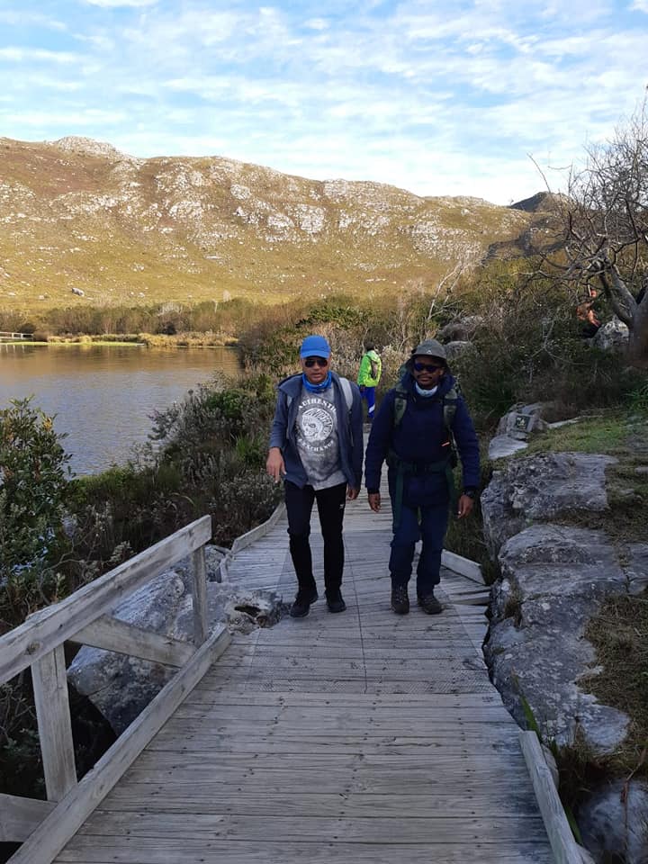 Hikers on a bridge